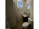 Practical bathroom featuring a vanity, toilet, and window, designed for functionality and natural light at 829 W Spray St, Superior, AZ 85173