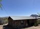 Outside the stone building showing its metal roof at 829 W Spray St, Superior, AZ 85173