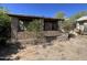 Rustic building exterior featuring charming brick columns and desert landscape views, blending nature and architecture at 829 W Spray St, Superior, AZ 85173