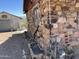 Exterior of a stone-sided building and metal shed, showing pipes and utilities at 829 W Spray St, Superior, AZ 85173