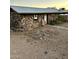 Charming stone house featuring a metal roof and a rustic exterior at 829 W Spray St, Superior, AZ 85173