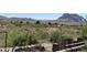 Scenic desert landscape with various plants and views of the mountainous terrain against a clear sky at 829 W Spray St, Superior, AZ 85173
