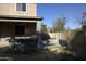 Spacious backyard featuring a covered patio, outdoor kitchen, and gated pool area, creating a versatile outdoor retreat at 8920 S 40Th Ln, Laveen, AZ 85339