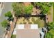 Overhead shot of the backyard with grass area, covered patio, and trampoline at 8920 S 40Th Ln, Laveen, AZ 85339
