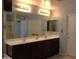 Elegant bathroom featuring dual sinks, spacious vanity, and modern fixtures at 8920 S 40Th Ln, Laveen, AZ 85339
