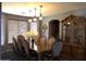 Formal dining room featuring a large wooden table and cabinet at 8920 S 40Th Ln, Laveen, AZ 85339