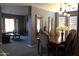 Dining room with wood table and access to the living room at 8920 S 40Th Ln, Laveen, AZ 85339