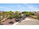 Charming home with a balcony, well-manicured front yard, and two-car garage amidst mature trees in a quiet neighborhood at 8920 S 40Th Ln, Laveen, AZ 85339