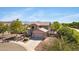 Charming two-story home featuring a balcony and mountain views with a two-car garage and well-manicured front yard at 8920 S 40Th Ln, Laveen, AZ 85339
