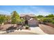 Charming two-story home featuring a balcony, a well-manicured front yard, and a convenient two-car garage at 8920 S 40Th Ln, Laveen, AZ 85339