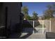 Gated backyard entrance providing easy access to a refreshing outdoor shower; ideal for enjoying the open air at 8920 S 40Th Ln, Laveen, AZ 85339