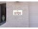 Close-up of house number '8920' on the exterior wall next to the garage at 8920 S 40Th Ln, Laveen, AZ 85339
