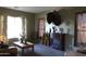 Cozy living room featuring a fireplace and comfortable seating at 8920 S 40Th Ln, Laveen, AZ 85339