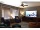 Cozy living room with entertainment center and large screen TV at 8920 S 40Th Ln, Laveen, AZ 85339