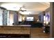 Open-concept living room with view of kitchen area and dining table at 8920 S 40Th Ln, Laveen, AZ 85339