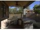 Inviting outdoor kitchen featuring a built-in grill and countertop space, perfect for entertaining in a backyard setting at 8920 S 40Th Ln, Laveen, AZ 85339