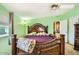 Bedroom boasts a decorative headboard, ceiling fan, and ample natural light at 9431 E Coralbell Ave # Ofc, Mesa, AZ 85208