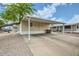 Spacious carport offering covered parking and shade, with low-maintenance landscaping at 9431 E Coralbell Ave # Ofc, Mesa, AZ 85208