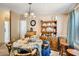 Inviting dining area featuring chandelier lighting and decorative wooden hutch at 9431 E Coralbell Ave # Ofc, Mesa, AZ 85208