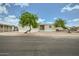 Well-maintained single-story home with xeriscaping and mature trees for shade at 9431 E Coralbell Ave # Ofc, Mesa, AZ 85208