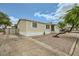 Single-story home with neutral paint, a storage shed, and low-maintenance front yard at 9431 E Coralbell Ave # Ofc, Mesa, AZ 85208