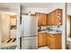 Efficient kitchen layout with wooden cabinetry and stainless steel refrigerator at 9431 E Coralbell Ave # Ofc, Mesa, AZ 85208