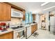 Functional kitchen with essential appliances including oven, microwave, and dishwasher at 9431 E Coralbell Ave # Ofc, Mesa, AZ 85208