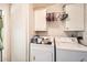 Functional laundry room equipped with a washer and dryer at 9431 E Coralbell Ave # Ofc, Mesa, AZ 85208