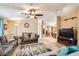 Spacious living room featuring a ceiling fan, comfortable seating, and an open layout at 9431 E Coralbell Ave # Ofc, Mesa, AZ 85208