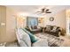Comfortable living room with ample seating, ceiling fan and soft natural lighting at 9431 E Coralbell Ave # Ofc, Mesa, AZ 85208