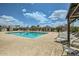 Community pool surrounded by lounge chairs and cabanas at 9431 E Coralbell Ave # Ofc, Mesa, AZ 85208