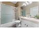 Bright bathroom featuring a shower-tub and white vanity with storage at 9550 E Thunderbird Rd # 214, Scottsdale, AZ 85260