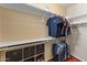 Walk-in closet with built-in shelving and hanging racks at 9550 E Thunderbird Rd # 214, Scottsdale, AZ 85260