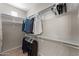 Spacious walk-in closet with built-in shelving and ample storage space at 9550 E Thunderbird Rd # 214, Scottsdale, AZ 85260