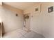 Charming condo front door with decorative wreath, cute flower mat, and unit number at 9550 E Thunderbird Rd # 214, Scottsdale, AZ 85260