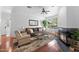 Comfortable living room with a plush sofa, fireplace, and large windows providing ample natural light at 9550 E Thunderbird Rd # 214, Scottsdale, AZ 85260
