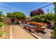 Inviting backyard with dining set, outdoor seating, and manicured landscaping, perfect for entertaining guests at 9623 N 34Th Pl, Phoenix, AZ 85028