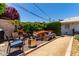 Charming backyard featuring outdoor dining, a fire pit, and comfortable seating, ideal for entertaining or relaxation at 9623 N 34Th Pl, Phoenix, AZ 85028