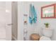 Bright, well-maintained bathroom with shower, toilet, and storage shelves at 9623 N 34Th Pl, Phoenix, AZ 85028