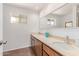 Spacious bathroom features a double sink vanity, large mirror, and natural light at 9623 N 34Th Pl, Phoenix, AZ 85028