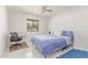 Bright bedroom featuring a desk, chair, bed, and neutral decor at 9623 N 34Th Pl, Phoenix, AZ 85028