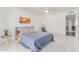 Comfortable bedroom with white walls, sunset wall art, and a cozy sitting area at 9623 N 34Th Pl, Phoenix, AZ 85028