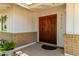 Attractive entryway with ornate wooden doors and a well-maintained facade at 9623 N 34Th Pl, Phoenix, AZ 85028