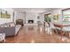 Cozy living space featuring a brick fireplace, dining area, and natural light, perfect for gatherings and relaxation at 9623 N 34Th Pl, Phoenix, AZ 85028