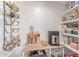 Pantry featuring wine rack, wooden table, and shelving, perfect for storage and organization at 9623 N 34Th Pl, Phoenix, AZ 85028