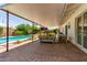 Inviting patio featuring comfortable seating, easy access to the pool, and backyard views at 9623 N 34Th Pl, Phoenix, AZ 85028