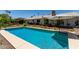 Sparkling pool with inviting blue water, set within a beautifully landscaped backyard with mature trees at 9623 N 34Th Pl, Phoenix, AZ 85028