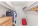 Organized walk-in closet with shelving, hanging racks, and a small dresser at 9623 N 34Th Pl, Phoenix, AZ 85028