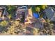 Aerial view of a custom home with a tile roof, pool, lush backyard, and desert landscaping at 9753 E Suncrest Rd, Scottsdale, AZ 85262