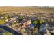 Panoramic aerial view of a luxury home with a pool, lush backyard, and a desert landscape backdrop at 9753 E Suncrest Rd, Scottsdale, AZ 85262